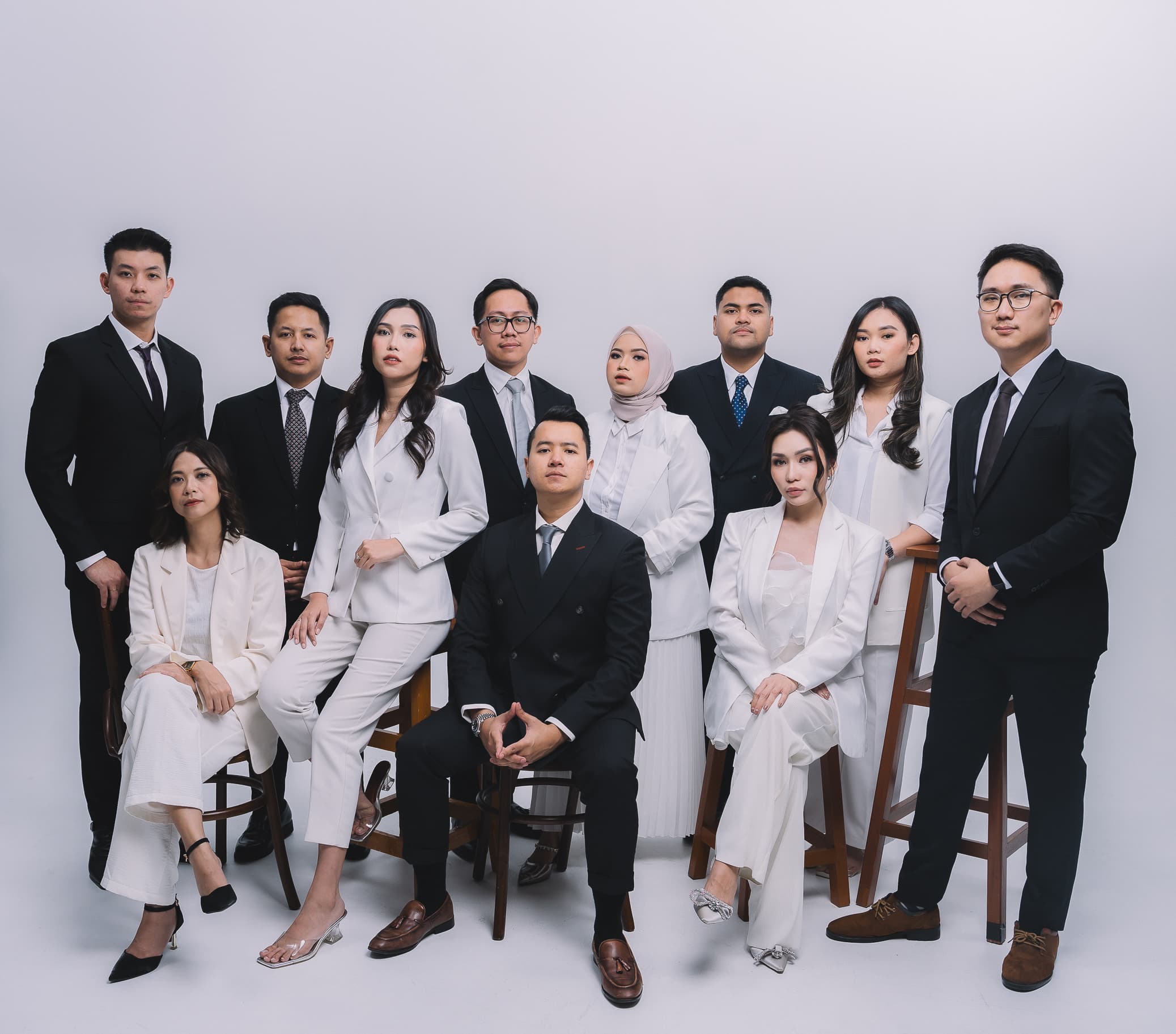 The ATMOZ by Vision team, photographed together in business attire.
